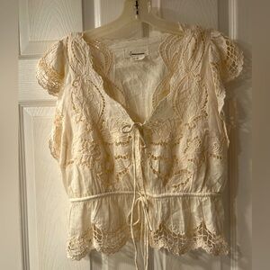 Lacey top with cap sleeves and built-in camisole. Worn once.